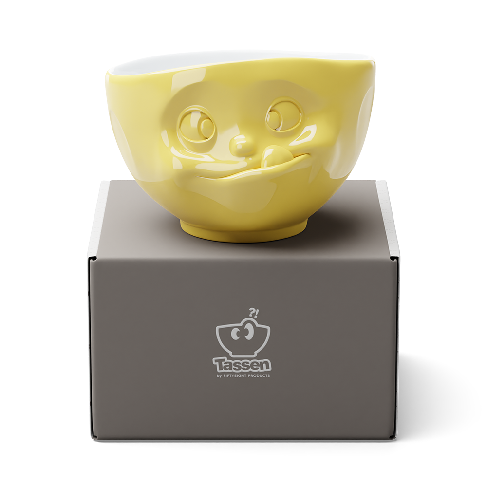 Premium porcelain bowl in yellow from the porcelain product family of fun dishware by FIFTYEIGHT Products. Offers 16 oz capacity perfect for serving cereal, soup, snacks and much more. Dishwasher and microwave safe bowl featuring a sculpted ‘tasty’ facial expression. Shipped in exclusively designed gift box.