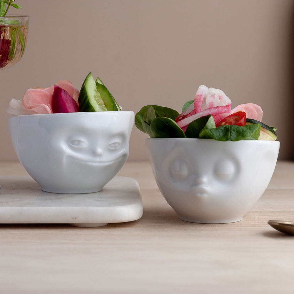 Set of two 3.3 oz. bowls in white from the porcelain product family of fun dishware by FIFTYEIGHT Products. Perfect for serving dips, sauces, nuts, sugar, spices, espresso, jam, honey, and more. Dishwasher and microwave safe bowls featuring 'grinning' and 'kissing' faces. Shipped in exclusively designed gift box.