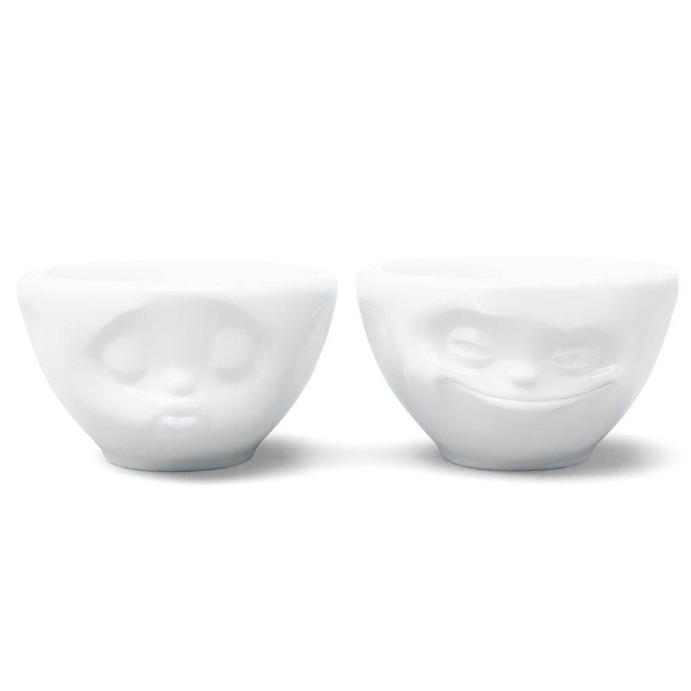 Set of two 3.3 oz. bowls in white from the porcelain product family of fun dishware by FIFTYEIGHT Products. Perfect for serving dips, sauces, nuts, sugar, spices, espresso, jam, honey, and more. Dishwasher and microwave safe bowls featuring 'grinning' and 'kissing' faces. Shipped in exclusively designed gift box.