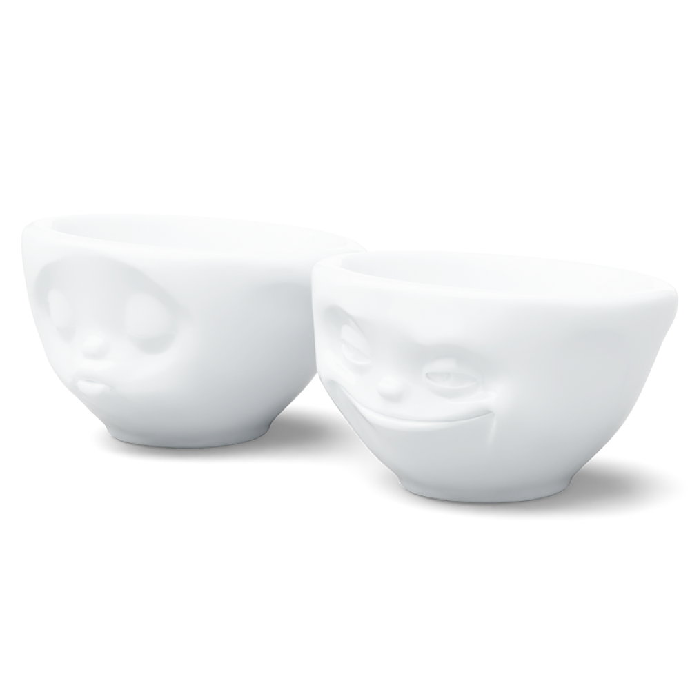 Set of two 3.3 oz. bowls in white from the porcelain product family of fun dishware by FIFTYEIGHT Products. Perfect for serving dips, sauces, nuts, sugar, spices, espresso, jam, honey, and more. Dishwasher and microwave safe bowls featuring 'grinning' and 'kissing' faces. Shipped in exclusively designed gift box.