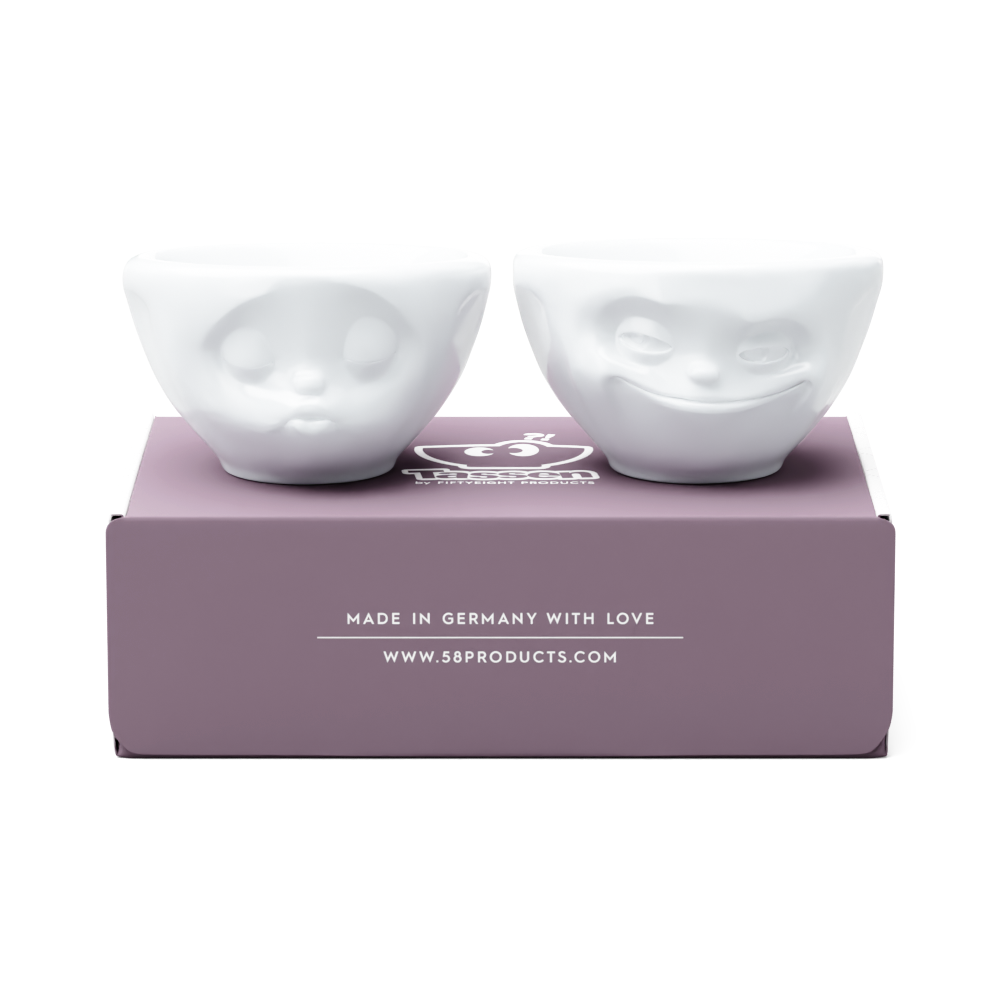 Set of two 3.3 oz. bowls in white from the porcelain product family of fun dishware by FIFTYEIGHT Products. Perfect for serving dips, sauces, nuts, sugar, spices, espresso, jam, honey, and more. Dishwasher and microwave safe bowls featuring 'grinning' and 'kissing' faces. Shipped in exclusively designed gift box.
