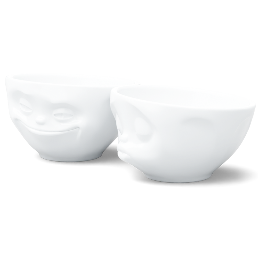 Set of two 6.5 oz. bowls in white from the porcelain product family of fun dishware by FIFTYEIGHT Products. Perfect for serving snacks, nuts, chips, dips, sauces, and a few scoops of ice cream. Dishwasher and microwave safe bowls featuring sculpted ‘grinning’ and 'kissing' faces. Shipped in exclusively designed gift box.
