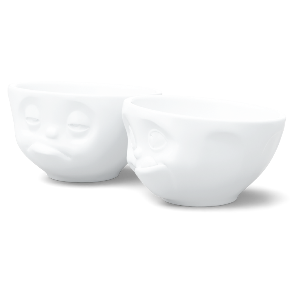 Set of two 6.5 oz. bowls in white from the porcelain product family of fun dishware by FIFTYEIGHT Products. Perfect for serving snacks, nuts, chips, dips, sauces, and a few scoops of ice cream. Dishwasher and microwave safe bowls featuring sculpted ‘tasty’ and 'snoozy' faces. Shipped in exclusively designed gift box.