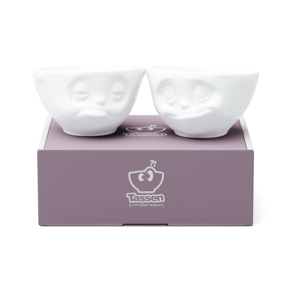 Set of two 6.5 oz. bowls in white from the porcelain product family of fun dishware by FIFTYEIGHT Products. Perfect for serving snacks, nuts, chips, dips, sauces, and a few scoops of ice cream. Dishwasher and microwave safe bowls featuring sculpted ‘tasty’ and 'snoozy' faces. Shipped in exclusively designed gift box.