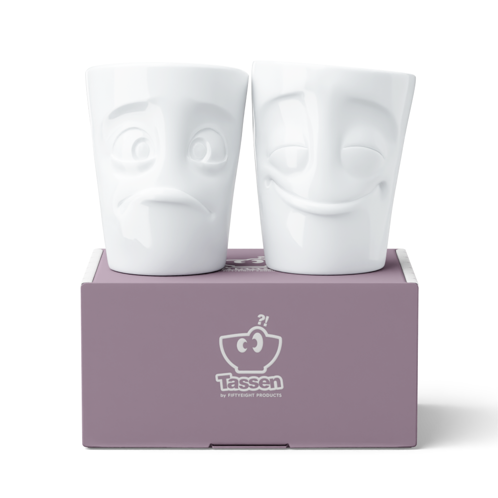 Set of two coffee mugs without handles in white from the porcelain product family of fun dishware by FIFTYEIGHT Products. Each offering 11 oz capacity. Dishwasher and microwave safe coffee cups with 'Cheery' and 'Baffled' facial expression. Shipped in exclusively designed gift box.