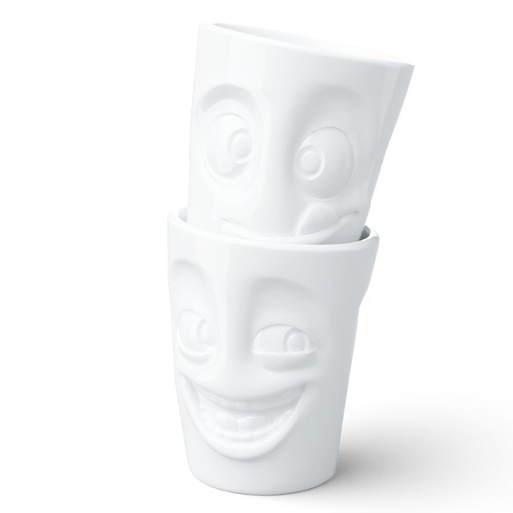 Set of two coffee mugs without handles in white from the porcelain product family of fun dishware by FIFTYEIGHT Products. Each offering 11 oz capacity. Dishwasher and microwave safe coffee cups with a 'joking' and one with a 'tasty' facial expression. Shipped in exclusively designed gift box.