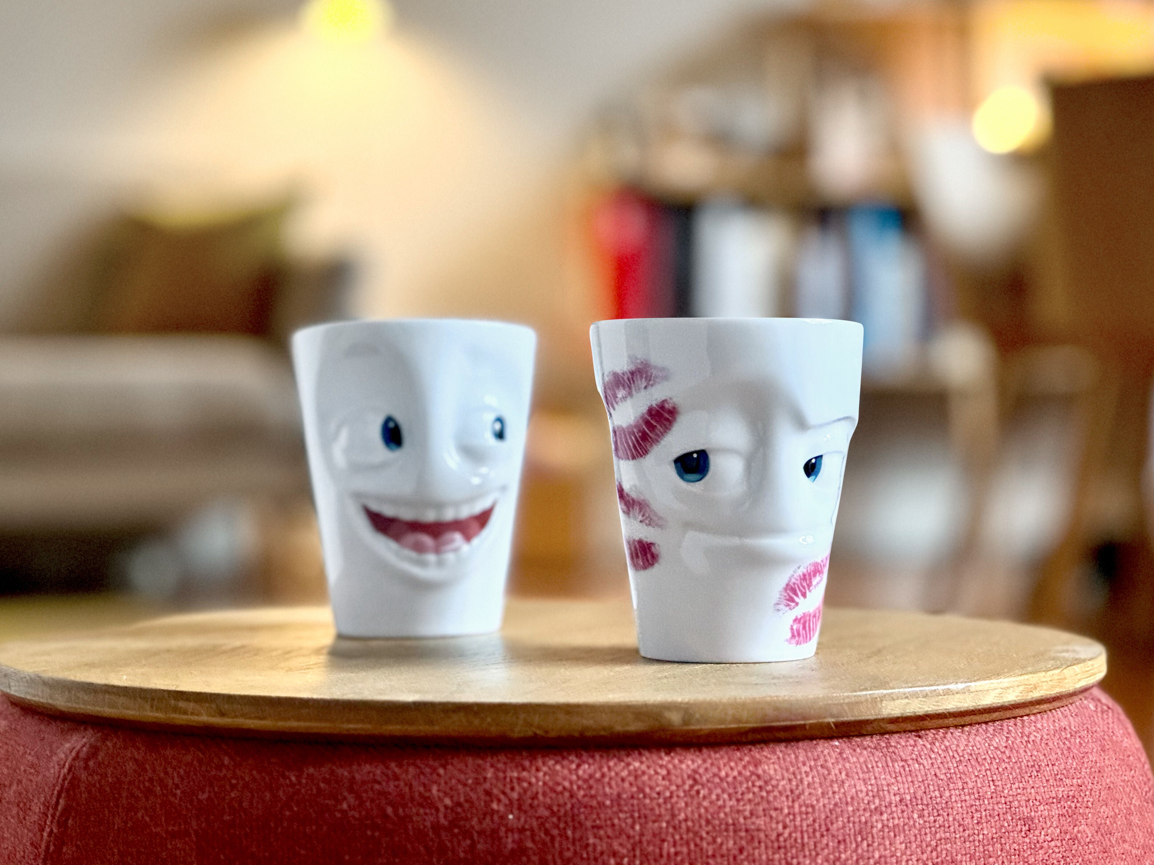 Premium porcelain coffee mug with handle from the popular porcelain family of fun dishware by FIFTYEIGHT Products. Special art edition with colorful accents . Offers 11 oz capacity for serving coffee, tea, latte, matcha, soup and more. Dishwasher and microwave safe cup with a 'impish' facial expression and fun lipstick marks as a KISSED edition. Shipped in exclusively designed gift box.