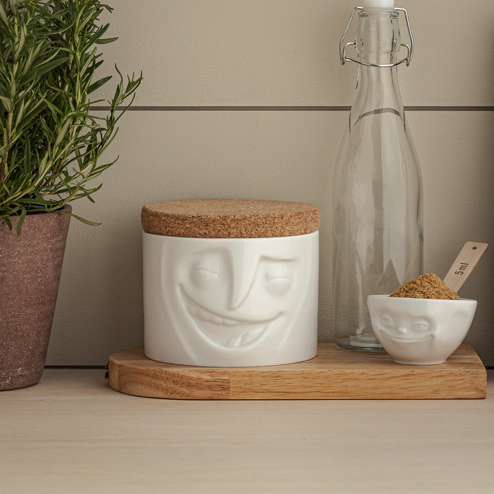 Quality porcelain storage jar with 30 oz. capacity and a 'cheerful' facial expression. Closes securely with a natural cork lid. Dishwasher and microwave-safe (except for cork lid).From the porcelain product family of fun dishware by FIFTYEIGHT Products. Made in Germany according to environmental standards.standards.