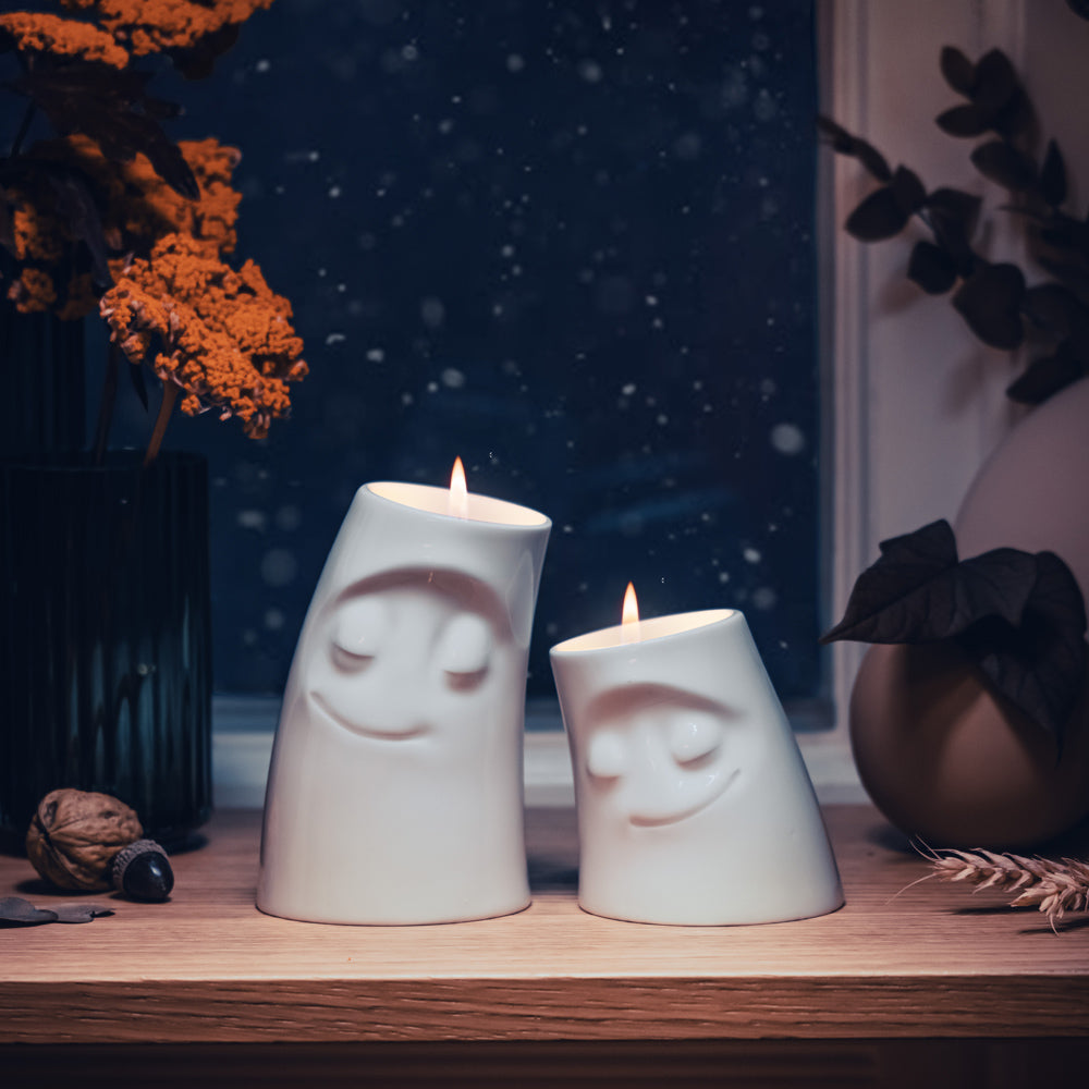 Exclusive designer candle holder with CUDDLY facial expression. Stands at 4.4 inches tall on a footed base and fits a tea light or LED light. From the TASSEN product family of fun dishware by FIFTYEIGHT Products. Made in Germany according to environmental standards.