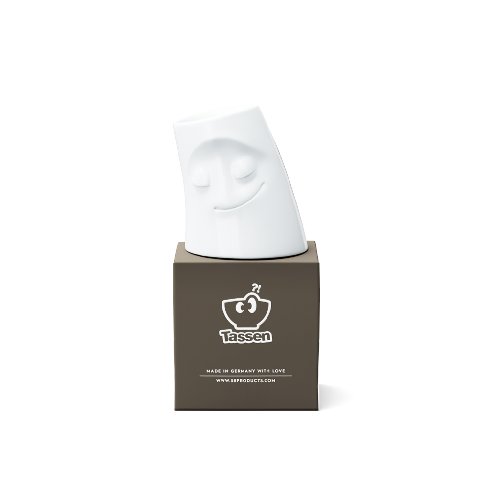 Exclusive designer candle holder with COZY facial expression. Stands at 3.3 inches tall on a footed base and fits a tea light or LED light. From the TASSEN product family of fun dishware by FIFTYEIGHT Products. Made in Germany according to environmental standards.