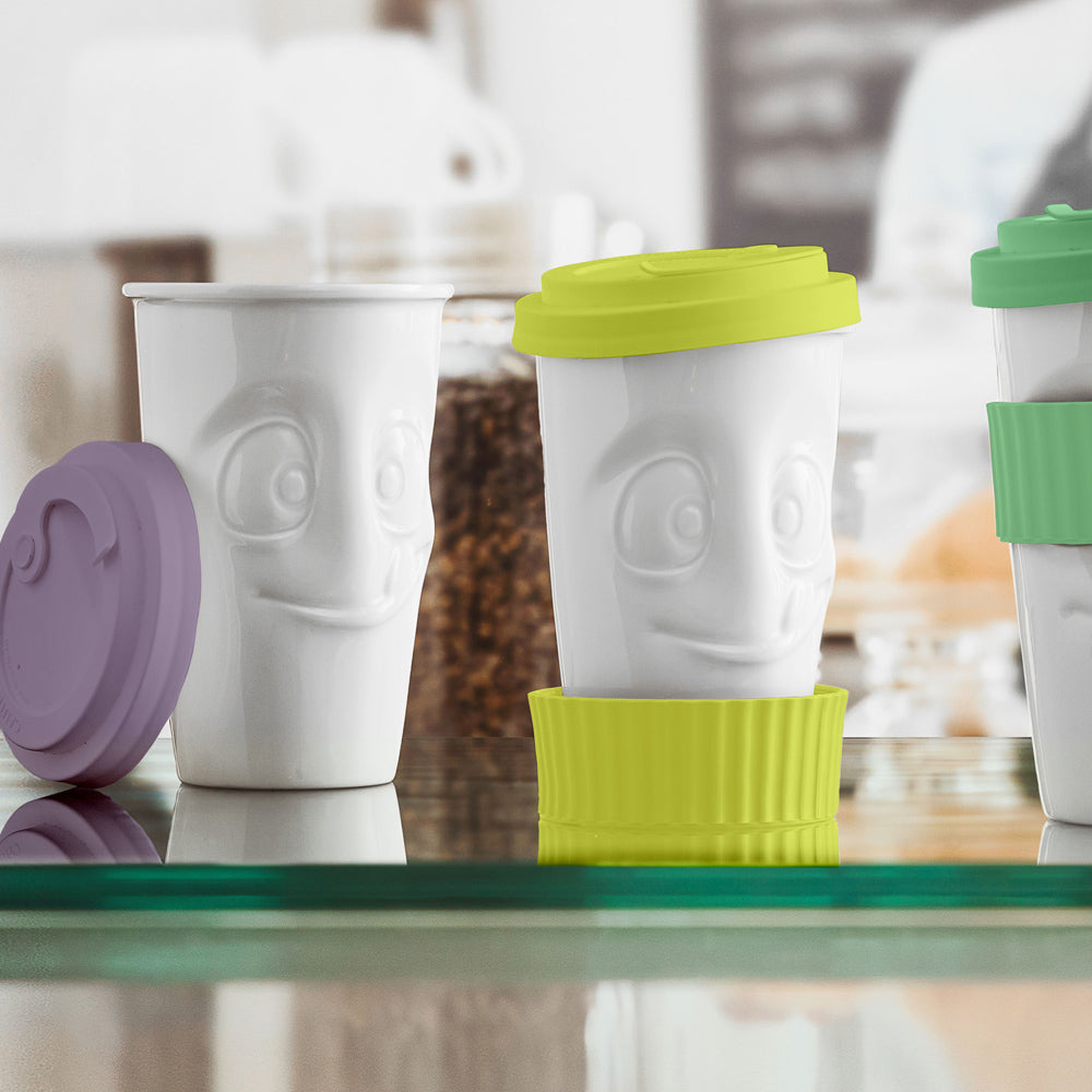 Premium porcelain coffee mug with a heat-retaining lid and protective sleeve and no handle from the porcelain product family of fun dishware by FIFTYEIGHT Products. Offers 13.5 oz capacity for enjoying coffee, tea, latte, matcha, and more on the go. Shipped in exclusively designed gift box.