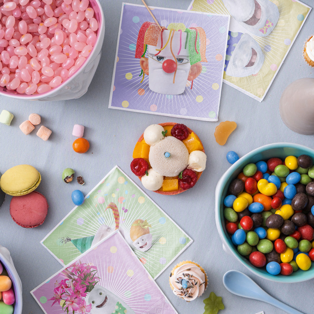Pack of 20 disposable paper napkins in transparent packaging. Colorful paper napkins featuring zany character artwork in "Happy Happy" design. 9.6 by 9.6 inches in size and Made in Germany according to environmental standards.