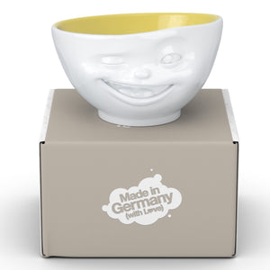 Premium porcelain bowl in white with Saffron Color Inside from the TASSEN product family of fun dishware by FIFTYEIGHT Products. Offers 16 oz capacity perfect for serving cereal, soup, snacks and much more. Dishwasher and microwave safe bowl featuring a sculpted ‘winking’ facial expression. Shipped in exclusively designed gift box.