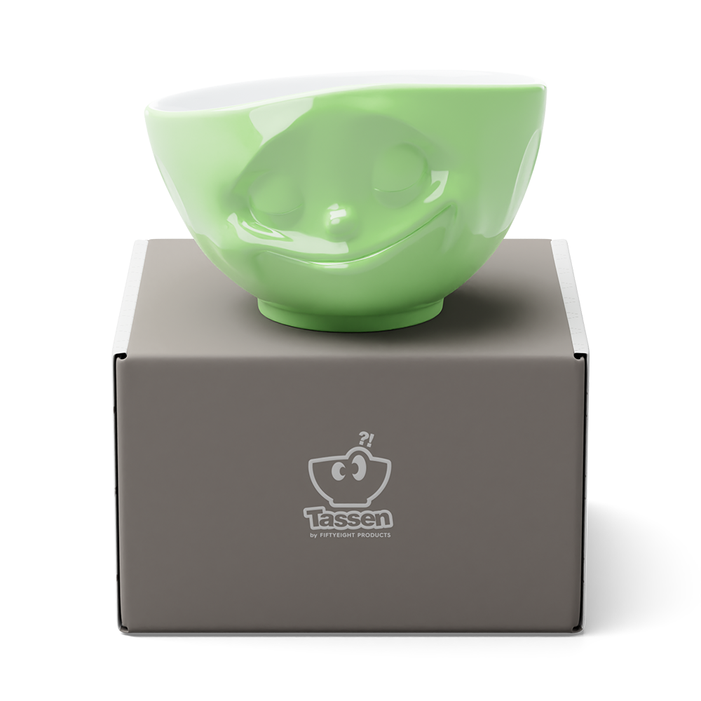 Premium porcelain bowl in light green from the porcelain product family of fun dishware by FIFTYEIGHT Products. Offers 16 oz capacity perfect for serving cereal, soup, snacks and much more. Dishwasher and microwave safe bowl featuring a sculpted ‘happy’ facial expression. Shipped in exclusively designed gift box.