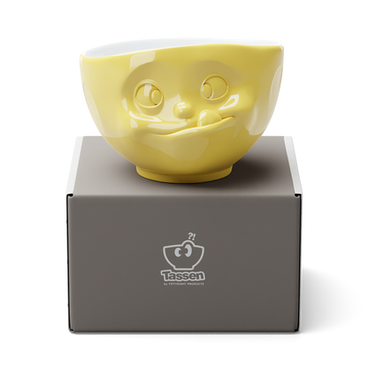 Premium porcelain bowl in yellow from the porcelain product family of fun dishware by FIFTYEIGHT Products. Offers 16 oz capacity perfect for serving cereal, soup, snacks and much more. Dishwasher and microwave safe bowl featuring a sculpted ‘tasty’ facial expression. Shipped in exclusively designed gift box.