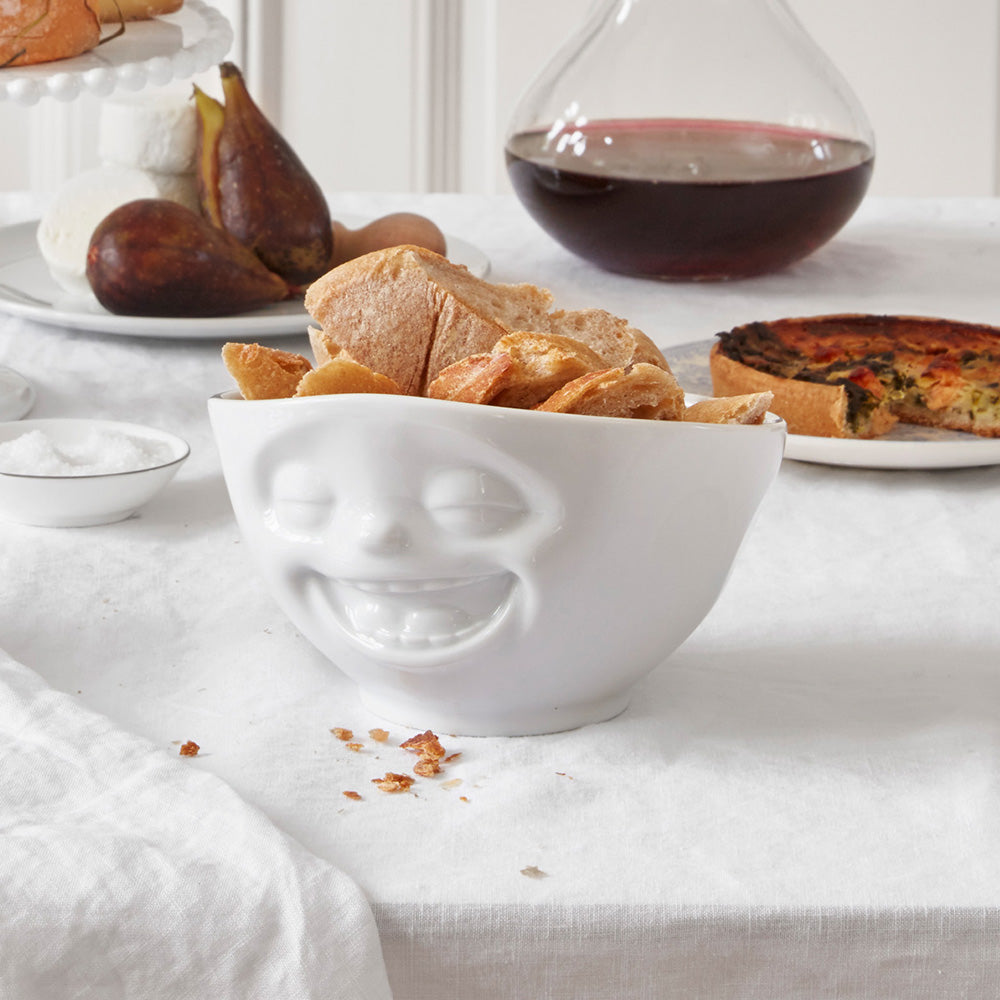 Premium porcelain bowl in white from the porcelain product family of fun dishware by FIFTYEIGHT Products. Offers 16 oz capacity perfect for serving cereal, soup, snacks and much more. Dishwasher and microwave safe bowl featuring a sculpted ‘laughing’ facial expression. Shipped in exclusively designed gift box.