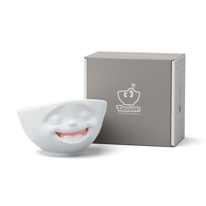 Premium porcelain bowl with colorful accents from TASSEN product family of fun dishware by FIFTYEIGHT Products. Offers 16 oz capacity perfect for serving cereal, soup, snacks and much more. Dishwasher and microwave safe bowl featuring a ‘Laughing’ facial expression and colorful details. Shipped in gift box.