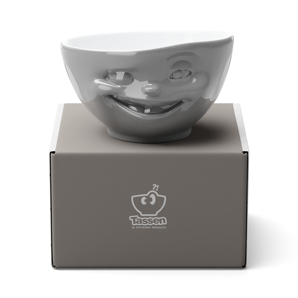 Premium porcelain bowl in grey color from the procelain product family of fun dishware by FIFTYEIGHT Products. Offers 16 oz capacity perfect for serving cereal, soup, snacks and much more. Dishwasher and microwave safe bowl featuring a sculpted ‘winking’ facial expression. Shipped in exclusively designed gift box.