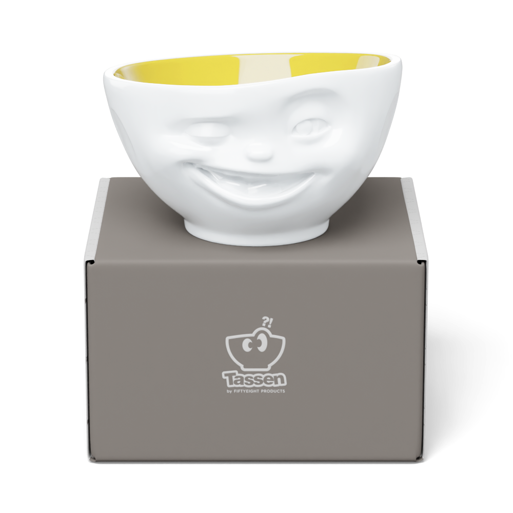 Premium porcelain bowl in white with Saffron Color Inside from the porcelain product family of fun dishware by FIFTYEIGHT Products. Offers 16 oz capacity perfect for serving cereal, soup, snacks and much more. Dishwasher and microwave safe bowl featuring a sculpted ‘winking’ facial expression. Shipped in exclusively designed gift box.