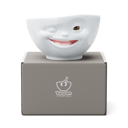 Premium porcelain bowl with colorful accents from TASSEN product family of fun dishware by FIFTYEIGHT Products. Offers 16 oz capacity perfect for serving cereal, soup, snacks and much more. Dishwasher and microwave safe bowl featuring a ‘Winking’ facial expression and colorful details. Shipped in gift box.