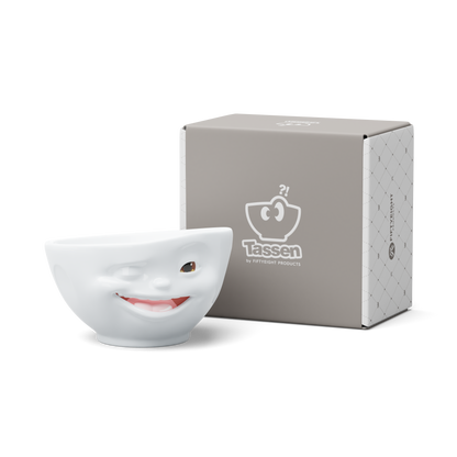 Premium porcelain bowl with colorful accents from TASSEN product family of fun dishware by FIFTYEIGHT Products. Offers 16 oz capacity perfect for serving cereal, soup, snacks and much more. Dishwasher and microwave safe bowl featuring a ‘Winking’ facial expression and colorful details. Shipped in gift box.