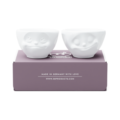 Set of two 3.3 oz. bowls in white from the porcelain product family of fun dishware by FIFTYEIGHT Products. Perfect for serving dips, sauces, nuts, sugar, spices, espresso, jam, honey, and more. Dishwasher and microwave safe bowls featuring 'happy' and 'Dreamy' faces. Shipped in exclusively designed gift box.
