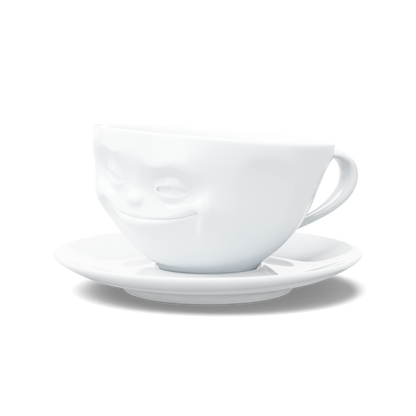 Premium porcelain coffee cup with saucer in white from the porcelain product family of fun dishware by FIFTYEIGHT Products. Offers 6.5 oz capacity and comes with a matching saucer. Dishwasher and microwave safe cup with a 'grinning' facial expression. Shipped in exclusively designed gift box.