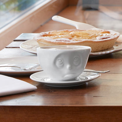 Coffee cup with a 'Oh Please' facial expression and 6.5 oz capacity. From the TASSEN product family of fun dishware by FIFTYEIGHT Products. Coffee cup with matching saucer crafted from quality porcelain.