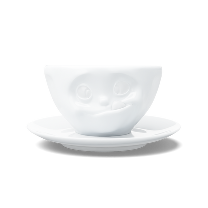 Premium porcelain coffee cup with saucer in white from the porcelain product family of fun dishware by FIFTYEIGHT Products. Offers 6.5 oz capacity and comes with a matching saucer. Dishwasher and microwave safe cup with a 'tasty' facial expression. Shipped in exclusively designed gift box.