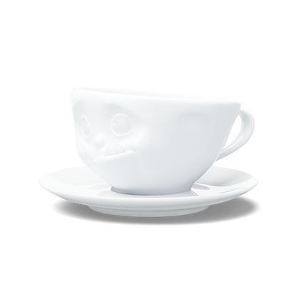 Premium porcelain coffee cup with saucer in white from the porcelain product family of fun dishware by FIFTYEIGHT Products. Offers 6.5 oz capacity and comes with a matching saucer. Dishwasher and microwave safe cup with a 'tasty' facial expression. Shipped in exclusively designed gift box.