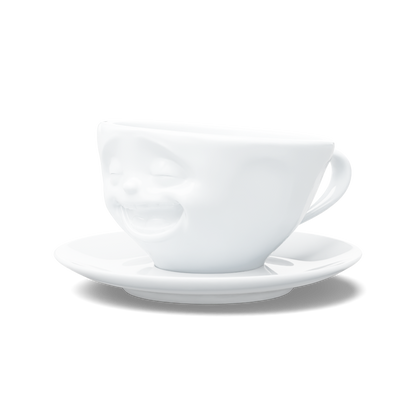 Premium porcelain coffee cup with saucer in white from the porcelain product family of fun dishware by FIFTYEIGHT Products. Offers 6.5 oz capacity and comes with a matching saucer. Dishwasher and microwave safe cup with a 'laughing' facial expression. Shipped in exclusively designed gift box.