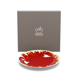 Porcelain dinner plate featuring elaborate red and yellow artwork with fire design with 11 inch diameter. Premium porcelain in hotel quality, from the TASSEN product family of fun dishware by FIFTYEIGHT Products.