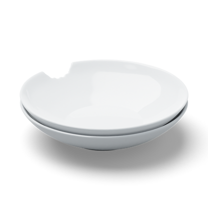 Set of two premium porcelain small deep plates in white with a 'bite mark' cutout at the edge. Dishwasher and microwave safes plate with a compact 7.1 inch diameter. From the porcelain product family of fun dishware by FIFTYEIGHT Products. Made in Germany according to environmental standards.