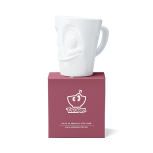 Premium porcelain coffee mug with handle from the porcelain product family of fun dishware by FIFTYEIGHT Products. Offers 11 oz capacity for serving coffee, tea, latte, matcha, soup and more. Dishwasher and microwave safe cup with a 'tasty' facial expression. Shipped in exclusively designed gift box.