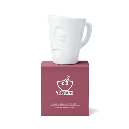 Premium porcelain coffee mug with handle from the popular product family of fun dishware by FIFTYEIGHT Products. Offers 11 oz capacity for serving coffee, tea, latte, matcha, soup and more. Dishwasher and microwave safe cup with a 'snoozy' facial expression. Shipped in exclusively designed gift box.