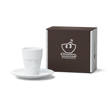 Load image into Gallery viewer, This amazing espresso mug with a &#39;grumpy&#39; facial expression and 2.7 oz capacity will start your day on a high note. Premium porcelain espresso cup in a tall &#39;mug&#39; design with saucer in white. From the TASSEN product family of fun dishware by FIFTYEIGHT Products.
