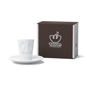 Espresso mug with a 'joking' facial expression and 2.7 oz capacity will start your day on a high note. Premium porcelain espresso cup in a tall 'mug' design with saucer in white. From the TASSEN product family of fun dishware by FIFTYEIGHT Products.
