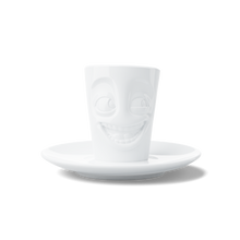 Load image into Gallery viewer, Espresso mug with a &#39;joking&#39; facial expression and 2.7 oz capacity will start your day on a high note. Premium porcelain espresso cup in a tall &#39;mug&#39; design with saucer in white. From the TASSEN product family of fun dishware by FIFTYEIGHT Products.

