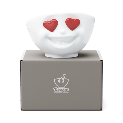 Premium porcelain bowl in white from the porcelain product family of fun dishware by FIFTYEIGHT Products. Featuring a sculpted ‘heartful’ facial expression inspired by heart eyes emoji with colorful eyes. Shipped in exclusively designed gift box.