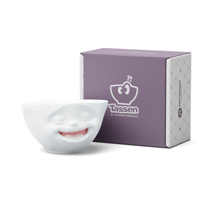 Premium porcelain bowl in white with colorful accents from the porcelain product family of fun dishware by FIFTYEIGHT Products. Offers 6.7 oz capacity perfect for serving ice cream to tapas, nuts and hearty dips. Dishwasher and microwave safe bowl featuring a sculpted ‘laughing’ facial expression. Shipped in exclusively designed gift box.
