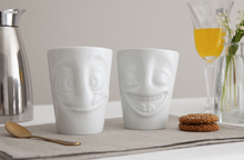 Load image into Gallery viewer, Set of two coffee mugs with &#39;joking&#39; and &#39;tasty&#39; facial expression and 11 oz capacity. From the TASSEN product family of fun dishware by FIFTYEIGHT Products. Tall coffee cups without handles in white, crafted from quality porcelain.
