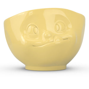 16 ounce capacity porcelain bowl in yellow featuring a sculpted ‘tasty’ facial expression. From the TASSEN product family of fun dishware by FIFTYEIGHT Products. Quality bowl perfect for serving cereal, soup, snacks and much more.