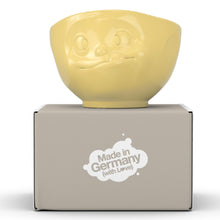 Load image into Gallery viewer, 16 ounce capacity porcelain bowl in yellow featuring a sculpted ‘tasty’ facial expression. From the TASSEN product family of fun dishware by FIFTYEIGHT Products. Quality bowl perfect for serving cereal, soup, snacks and much more.
