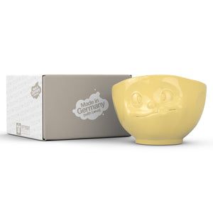 16 ounce capacity porcelain bowl in yellow featuring a sculpted ‘tasty’ facial expression. From the TASSEN product family of fun dishware by FIFTYEIGHT Products. Quality bowl perfect for serving cereal, soup, snacks and much more.