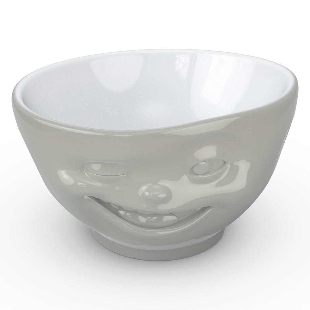 Premium porcelain bowl in grey color from the TASSEN product family of fun dishware by FIFTYEIGHT Products. Offers 16 oz capacity perfect for serving cereal, soup, snacks and much more. Dishwasher and microwave safe bowl featuring a sculpted ‘winking’ facial expression. Shipped in exclusively designed gift box.