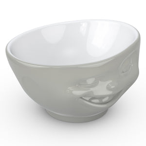 Premium porcelain bowl in grey color from the TASSEN product family of fun dishware by FIFTYEIGHT Products. Offers 16 oz capacity perfect for serving cereal, soup, snacks and much more. Dishwasher and microwave safe bowl featuring a sculpted ‘winking’ facial expression. Shipped in exclusively designed gift box.