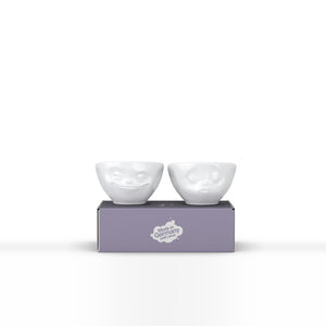 Set of two 3.3 oz. bowls in white featuring sculpted 'grinning' and 'kissing' faces. From the TASSEN product family of fun dishware by FIFTYEIGHT Products. Quality bowl perfect for serving dips, sauces, nuts, sugar, spices, espresso, jam, marmalade, honey, and more.
