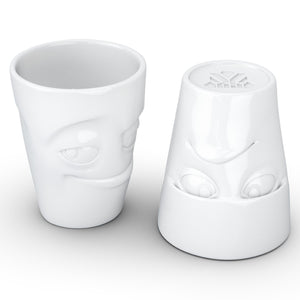 Set of two coffee mugs with 'Grumpy' and 'Impish' facial expression and 11 oz capacity. From the TASSEN product family of fun dishware by FIFTYEIGHT Products. Tall coffee cups without handles in white, crafted from quality porcelain.