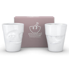 Load image into Gallery viewer, Set of two coffee mugs with &#39;Grumpy&#39; and &#39;Impish&#39; facial expression and 11 oz capacity. From the TASSEN product family of fun dishware by FIFTYEIGHT Products. Tall coffee cups without handles in white, crafted from quality porcelain.
