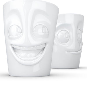 Set of two coffee mugs with 'joking' and 'tasty' facial expression and 11 oz capacity. From the TASSEN product family of fun dishware by FIFTYEIGHT Products. Tall coffee cups without handles in white, crafted from quality porcelain.